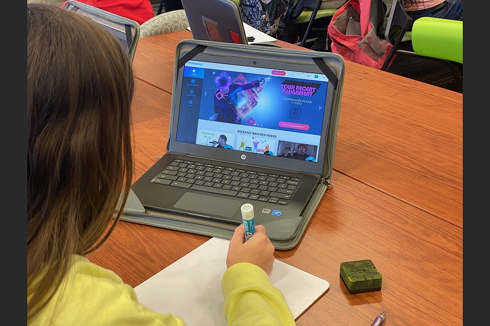 A student at Don Tyson School of Innovation in Springdale uses Muzology during class. (Special to the Democrat-Gazette)