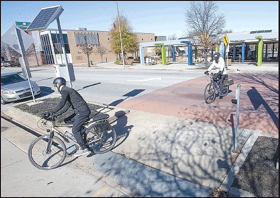 Cyclists cross Emma Avenue in Springdale on Sunday on the Razorback Greenway. Go to nwaonline.com/201116Daily/ and nwadg.com/photos to see more photos. (NWA Democrat-Gazette/J.T. Wampler)