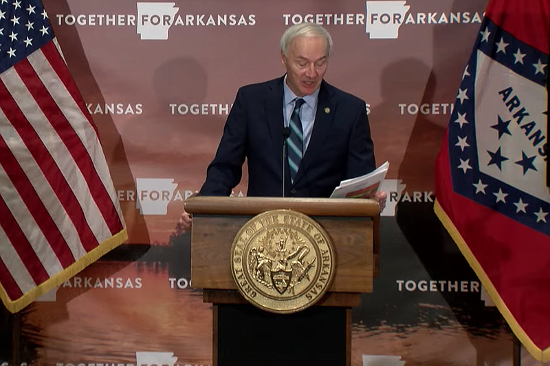 Arkansas Gov. Asa Hutchinson speaks to reporters at the state Capitol in Little Rock on Tuesday in this still of video provided by the governor's office. 