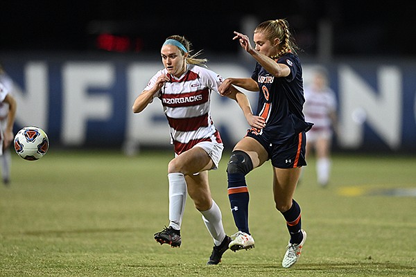 Arkansas' Anna Podojil (left) pursues a ball against Auburn's Madeline Moore during an SEC Tournament game Tuesday, Nov. 17, 2020, in Orange Beach, Ala. Arkansas' Anna Podojil (left) pursues a ball against Auburn's Madeline Moore during an SEC Tournament game Tuesday, Nov. 17, 2020, in Orange Beach, Ala.