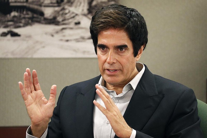 FILE - In this April 24, 2018, file photo, illusionist David Copperfield appears in court in Las Vegas. Copperfield is suspending his Las Vegas stage show in the wake of a crew member testing positive for COVID-19. The Las Vegas Review Journal reported Monday, Nov. 16, 2020, that the legendary magician has "no idea yet" when his production at MGM Grand will resume. (AP Photo/John Locher, File)