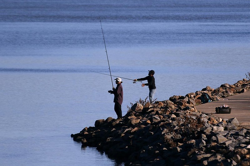 A pair of fisherman cast their lines into the Arkansas River while fishing on Monday, Nov. 16, 2020, at Cook's Landing in North Little Rock. 
(Arkansas Democrat-Gazette/Thomas Metthe)
