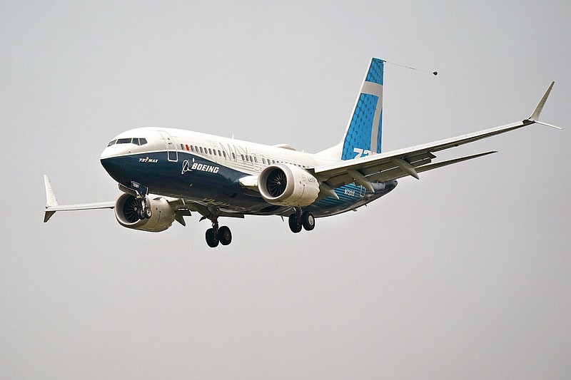 FILE - In this Wednesday, Sept. 30, 2020, file photo, a Boeing 737 Max jet, piloted by Federal Aviation Administration Chief Steve Dickson, prepares to land at Boeing Field following a test flight in Seattle.