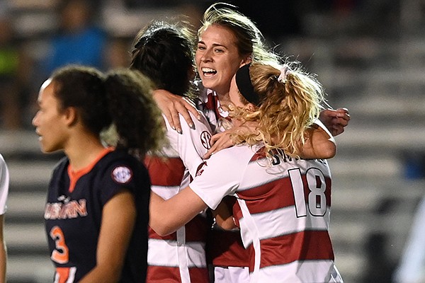 Arkansas' Kayla McKeon (center) celebrates with teammates after scoring a goal during the first half of an SEC Tournament game against Auburn on Tuesday, Nov. 17, 2020, in Orange Beach, Ala.