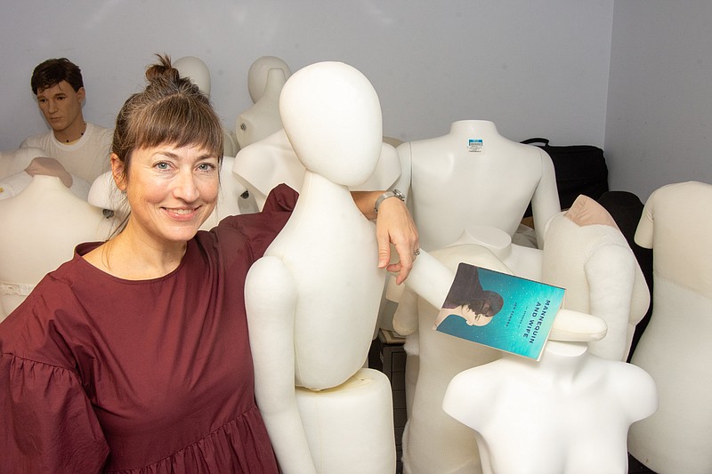 Writer Jen Fawkes poses with mannequins at the Old State House Museum. The Little Rock author has a new book of short stories, “Mannequin and Wife.” (Arkansas Democrat-Gazette/Cary Jenkins)