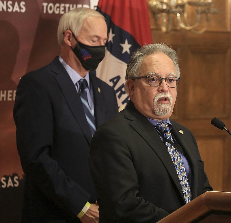 Health Secretary Dr. Jose Romero, right, along with Gov. Asa Hutchinson speaks Tuesday Nov. 17, 2020 in Little Rock during the weekly covid-19 press conference at the state Capitol. More photos at arkansasonline.com/1118governor/. (Arkansas Democrat-Gazette/Staton Breidenthal)