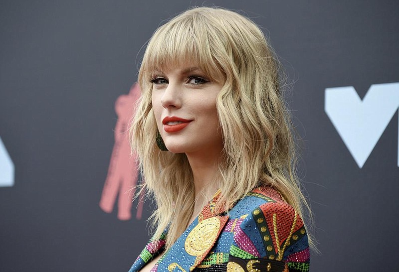 FILE - Singer-songwriter Taylor Swift arrives at the MTV Video Music Awards in Newark, N.J. on Aug. 26, 2019. Swift was nominated for four American Music Awards on Monday, Oct. 26. She has the chance to extend her lead as the most awarded artist in AMA history. She already has 29 wins. The AMAs will air on Nov. 22 on ABC. (Photo by Evan Agostini/Invision/AP, File) story.lead_photo.caption