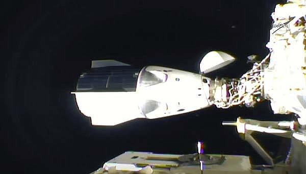 In this frame grab from NASA TV, the SpaceX Dragon sits docked at the International Space Station late Monday. (AP/NASA) 