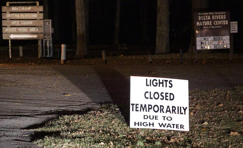 Visitors to Regional Park Tuesday night looking for Christmas lights were greeted by a sign notifying visitors that, due to high water, the Christmas light display by the Arkansas river was closed. It was not immediately known when the display may be opened back to the public. (Pine Bluff Commercial/Dale Ellis)