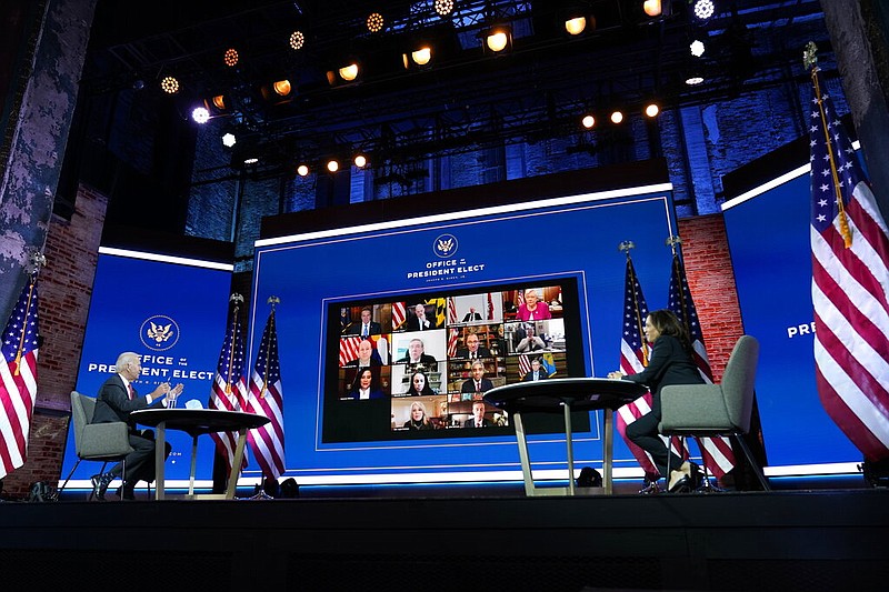 Former Vice President Joe Biden and Sen. Kamala Harris (right), D-Calif., participate in a meeting with the National Governors Association's executive committee at The Queen theater in Wilmington, Del., on Thursday, Nov. 19, 2020. Arkansas Gov. Asa Hutchinson's screen is on the top row, second from right.