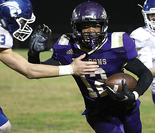 Sianahara Bonnet/News-Times In this file photo, Junction City’s Jamal Johnson looks to break a tackle during the Dragons’ 2019 2A playoff game against Hector at David Carpenter Stadium. Junction City takes on McCrory in the second round of the playoffs on Friday. Game time is set for 7 p.m.