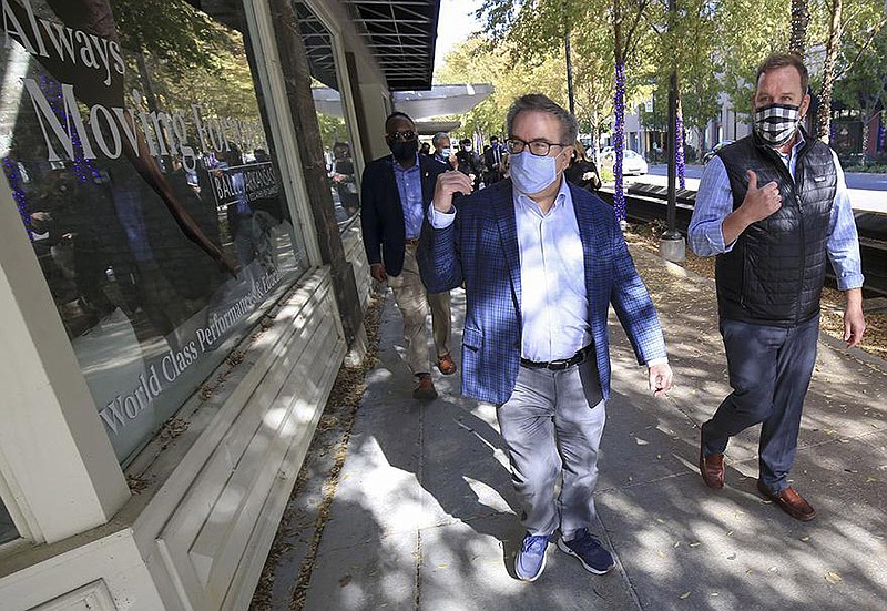 Environmental Protection Agency administrator Andrew Wheeler (left) tours revitalized areas of downtown Little Rock with Pulaski County Brownsfields Program administrator Josh Fout on Thursday. The revitalization projects used EPA grant funds.
(Arkansas Democrat-Gazette/Staton Breidenthal)