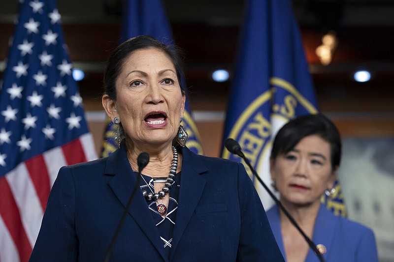 U.S. Rep. Deb Haaland, D-N.M., co-chair of the Native American Caucus, speaks to reporters on Capitol Hill in Washington in this March 5, 2020, file photo. At right is U.S. Rep. Judy Chu, D-Calif., chairwoman of the Congressional Asian Pacific American Caucus.