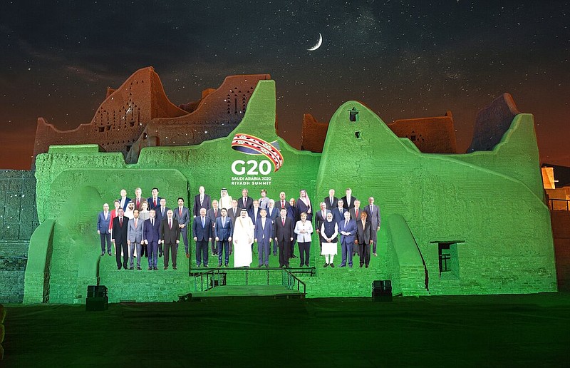 In this handout image provided by DGDA, Diriyah Gate Development Authority of Saudi, a family photo featuring members of the G20 is projected onto the walls of Salwa Palace, At Turaif on Saturday, Nov. 20, 2020 in Diriyah, on the outskirts of Riyadh, Saudi Arabia. story.lead_photo.caption