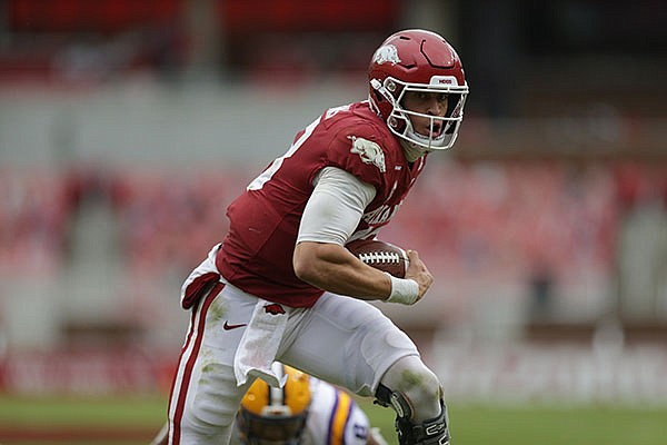 Arkansas quarterback Feleipe Franks runs with the ball during a game against LSU on Saturday, Nov. 21, 2020, in Fayetteville.