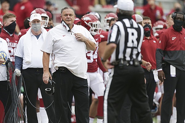Arkansas coach Sam Pittman looks toward referee Marc Curles during a game against LSU on Saturday, Nov. 21, 2020, in Fayetteville.