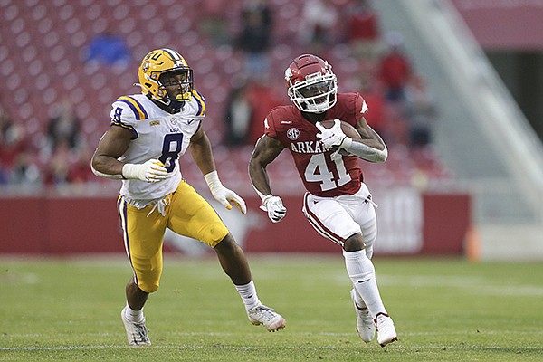 Arkansas receiver T.J. Hammonds (41) runs with the ball during a game against LSU on Saturday, Nov. 21, 2020, in Fayetteville.