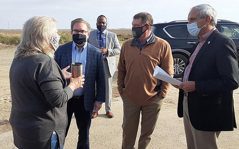 EPA Administrator Andrew Wheeler (center, left) speaks with farmers Lori Dabbs (far left), Terry Dabbs (center, right) and EPA Region 6 Administrator Ken McQueen (far right) in Stuttgart on Friday.
(Arkansas Democrat-Gazette/Neal Earley)