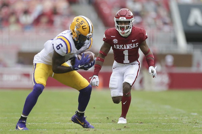 Arkansas defensive back Jalen Catalon (1) covers LSU wide receiver Terrace Marshall Jr. (6), Saturday, November 21, 2020 during the third quarter of a football game at Donald W. Reynolds Razorback Stadium in Fayetteville. Check out nwaonline.com/201122Daily/ for today's photo gallery. 
(NWA Democrat-Gazette/Charlie Kaijo)