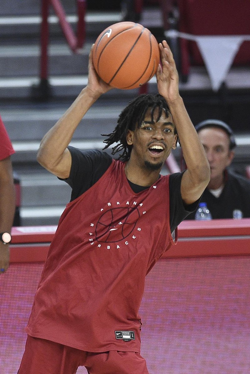 Arkansas guard Jalen Tate (11) passes, Thursday, November 11, 2020 during the Red-White instrasquad basketball game at Walton Arena in Fayetteville. Check out nwaonline.com/201113Daily/ for today's photo gallery. 
(NWA Democrat-Gazette/Charlie Kaijo)