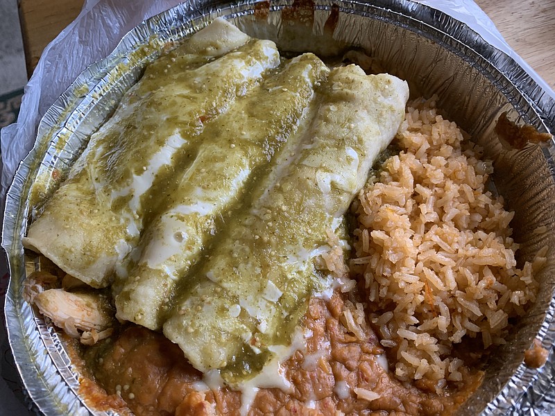 Enchiladas Verdes, with rice and beans, provided a fully fillilng lunch from El Porton on West Markham Street. (Arkansas Democrat-Gazeette/Eric E. Harrison)
