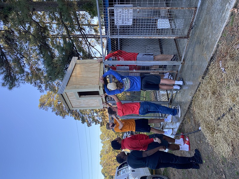 Tanner Nielsen and some members of the Magnolia football team delivered seven newly-built dog houses to CCAPS. Nielsen built the house as part of his Eagle Scout project and solicited his teammates to help deliver them.