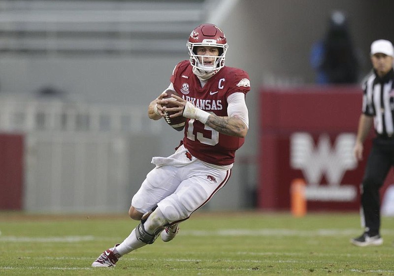 Arkansas quarterback Feleipe Franks (13) carries the ball, Saturday, November 21, 2020 during the fourth quarter of a football game at Donald W. Reynolds Razorback Stadium in Fayetteville. Check out nwaonline.com/201122Daily/ for today's photo gallery. 
(NWA Democrat-Gazette/Charlie Kaijo)