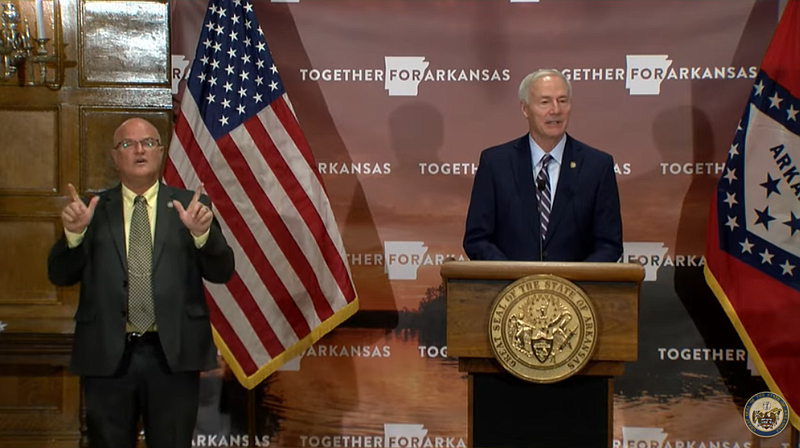 Gov. Asa Hutchinson, right, speaks during his weekly coronavirus briefing, Tuesday, Nov. 24, 2020.