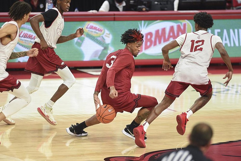 Arkansas junior guard Desi Sills (left) acknowledged the honor of being named to the preseason All-SEC second team and plans to keep pace going into this season, which begins Wednesday against Mississippi Valley State in Walton Arena. 
(NWA Democrat-Gazette/Charlie Kaijo) 