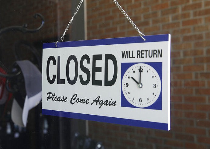 FILE - In this July 18, 2020 file photo a closed sign hangs in the window of a barber shop in Burbank, Calif. (AP Photo/Marcio Jose Sanchez, File)

