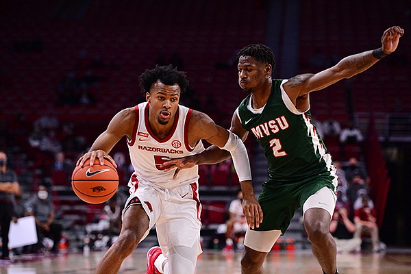 Arkansas' Moses Moody (5) is guarded by Mississippi Valley State's Kam'Ron Cunningham (2) during a game Wednesday, Nov. 25, 2020, in Fayetteville. 