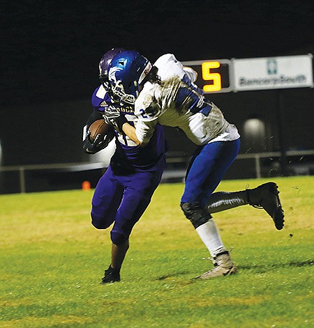 Siandhara Bonnet/News-Times In this file photo, Junction City running back Jamal Johnson tries to break free from a Hector defender during their 2019 2A second-round playoff game at David Carpenter Stadium.