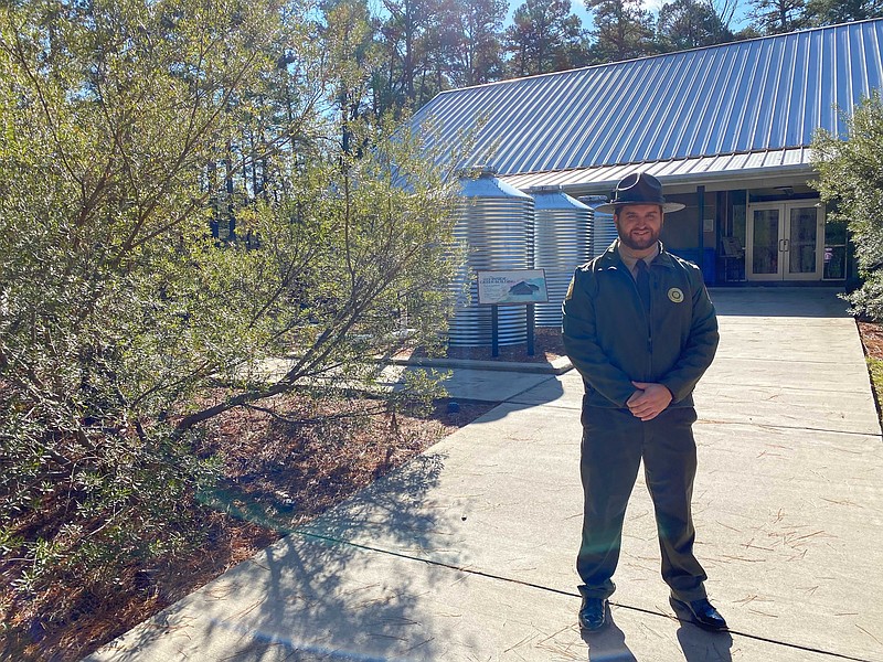 Logoly State Park Superintendent Corbin Merriott stands in front of the park’s visitor center. Merriott formerly served as the Assistant Superintendent to White Oak State Park before coming to Logoly. (Rhett Gentry/Banner News)