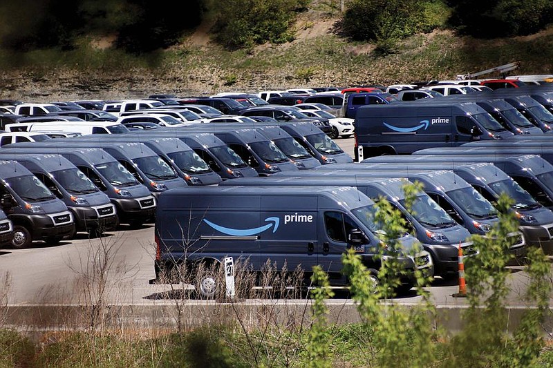 Amazon Prime delivery vans sit stored in a Cranberry Township, Pa., parking lot in May. Some package delivery companies are having a hard time finding enough vans to meet increased demand. Amazon says it hasn’t seen signs of a shortage.
(AP)