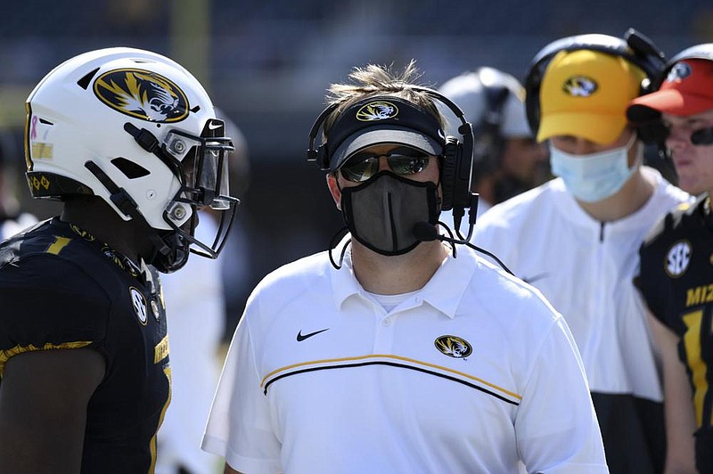 Missouri head coach Eliah Drinkwitz watches from the sidelines during the second half of an NCAA college football game against LSU Saturday, Oct. 10, 2020, in Columbia, Mo. (AP Photo/L.G. Patterson)