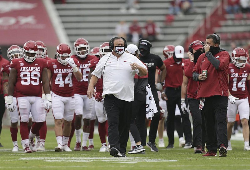 Arkansas head coach Sam Pittman walks down the field with his players, Saturday, November 21, 2020 during the second quarter of a football game at Donald W. Reynolds Razorback Stadium in Fayetteville. Check out nwaonline.com/201122Daily/ for today's photo gallery. 
(NWA Democrat-Gazette/Charlie Kaijo)