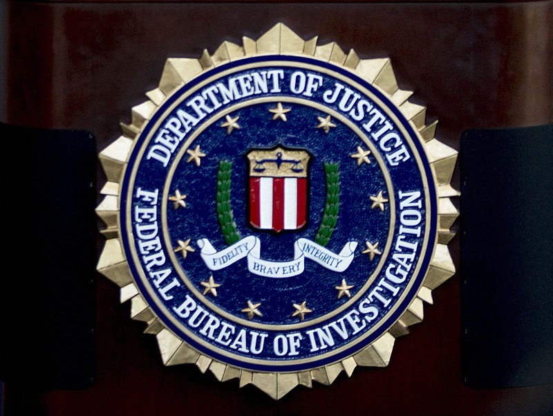The FBI seal is shown at a press conference in Cincinnati on Thursday, Nov. 19, 2020. (Albert Cesare/The Cincinnati Enquirer via AP)