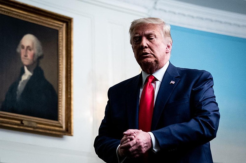 President Donald Trump departs the Roosevelt Room of the White House after a Thanksgiving call to military personnel. “I know the answer,” Trump said when asked whether he would attend President-elect Joe Biden’s inauguration, but he declined to reveal it.
(The New York Times/Erin Schaff)

