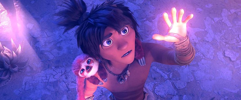 Nomadic evolutionary leap forward Guy (voiced by Ryan Reynolds) and his furry sloth friend Belt (Christopher Sanders), who holds up Guy’s pants, are part of the cast in the animated comedy “The Croods: A New Age.”