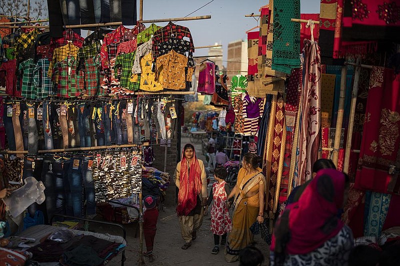 A market on the outskirts of New Delhi appears full of merchandise but few shoppers as many small manufacturers say their businesses are on the verge of collapse.
(AP/Altaf Qadri) 