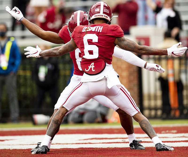 Alabama wide receiver DeVonta Smith and teammate John Metchie III (8) celebrate Smith’s touchdown during the Crimson Tide’s victory over Auburn on Saturday in Tuscaloosa, Ala.
(AP/The Montgomery Advertiser/Mickey Welsh)