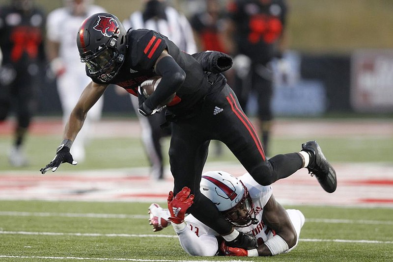 South Alabama safety Keith Gallmon (bottom) brings down Arkansas State wide receiver Jeff Foreman during the fourth quarter Saturday. Gallmon led the Jaguars’ defense with 11 tackles, including eight solo.
(Arkansas Democrat-Gazette/Thomas Metthe)