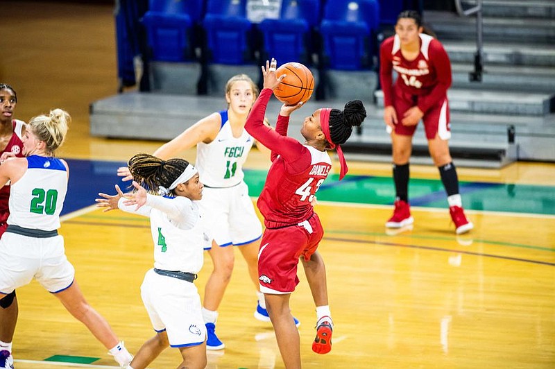 Makayla Daniels (right) of Arkansas shoots over a Florida Gulf Coast defender Saturday during the No. 14 Razorbacks’ 86-80 victory at the Gulf Coast Showcase in Fort Myers, Fla. Daniels finished with 15 points.
(Photo courtesy Florida Gulf Coast University/Brad Young)