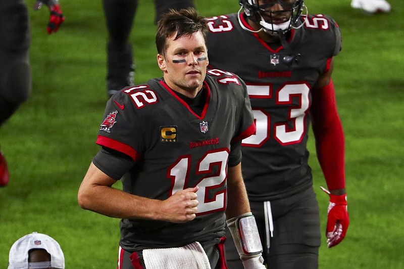 Tampa Bay Buccaneers quarterback Tom Brady (12) runs to the tunnel during halftime of an NFL Football game against the Los Angeles Rams, Monday, Nov. 23, 2020, in Tampa, Fla. (AP Photo/Kevin Sabitus)