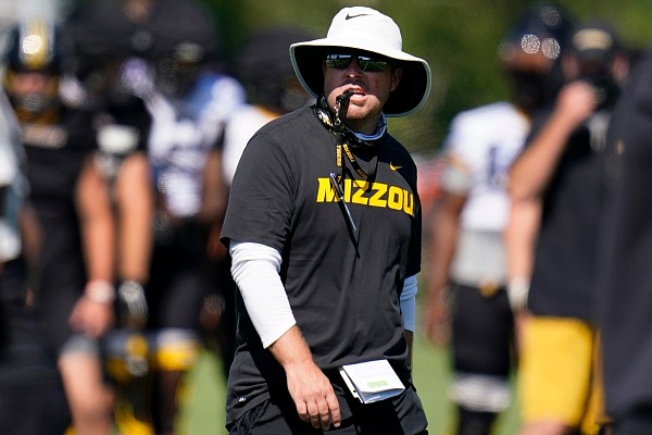Missouri head coach Eliah Drinkwitz prepares to blow a whistle during an NCAA college football practice Wednesday, Aug. 19, 2020, in Columbia, Mo. (AP Photo/Jeff Roberson)
