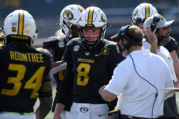 Missouri head coach Eliah Drinkwitz talks with quarterback Connor Bazelak (8) during the second half of an NCAA college football game against LSU Saturday, Oct. 10, 2020, in Columbia, Mo. (AP Photo/L.G. Patterson)