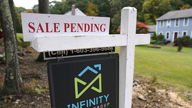 FILE - In this Sept. 29, 2020 file photo, a sale pending sign is displayed outside a residential home for sale in East Derry, N.H. 