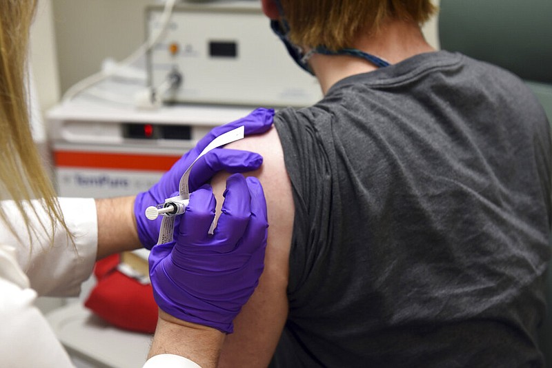 FILE - This May 4, 2020, file photo provided by the University of Maryland School of Medicine, shows the first patient enrolled in Pfizer's covid-19 coronavirus vaccine clinical trial at the University of Maryland School of Medicine in Baltimore.