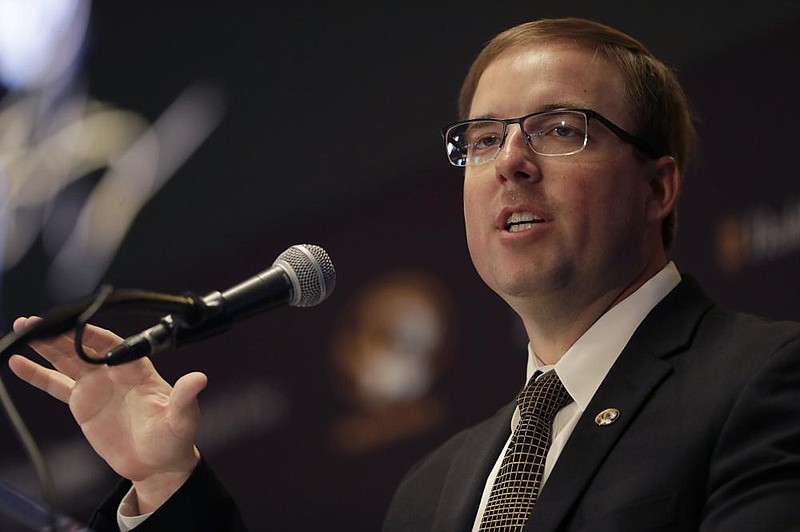 FILE - In this Dec. 10, 2019, file photo, Eliah Drinkwitz is introduced as the new head football coach at the University of Missouri, in Columbia, Mo. Last week, members of the Missouri football team marched from The Columns on campus to downtown Columbia in protest of racial injustice. The idea came from sophomore safety Martez Manuel, but it quickly gained the support of new coach Eli Drinkwitz and his staff. (AP Photo/Jeff Roberson, File)