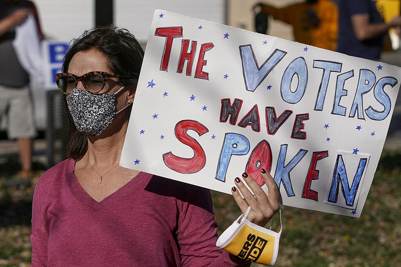 A supporter reacts to election news in Milwaukee in this Nov. 7, 2020, file photo. The Wisconsin Supreme Court on Thursday, Dec. 3, 2020, refused to hear President Donald Trump's attempt to overturn his election loss to Democrat Joe Biden in the battleground state.